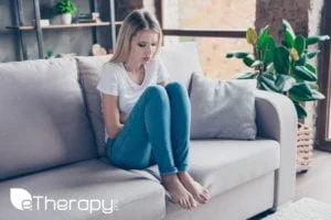 lady sitting on sofa with Anxiety Disorders