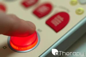 A close-up view of a finger pressing a red button - Borderline Personality Disorder Test (BPD test) What Causes the Need for Testing